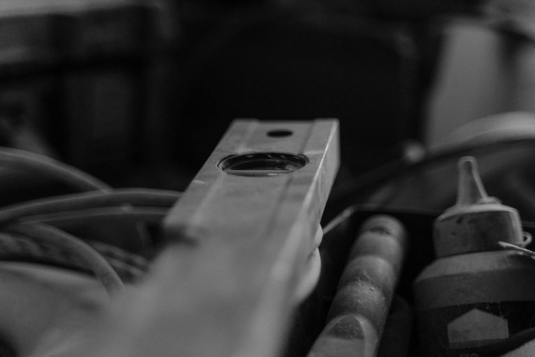 Black and white image of construction tools in a workshop or job site